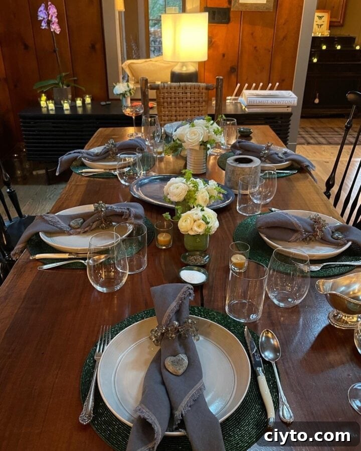 New Year's Eve Dinner Recipes and Menu Ideas 4 a photo of a tablesetting with plates, napkins, glassware, silverware and flowers in the middle