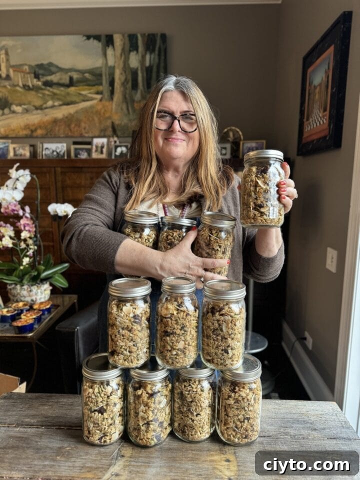 New Year's Eve Dinner Recipes and Menu Ideas 7 a photo of teri holding a jar of granola and leaning on a stack of granola jars