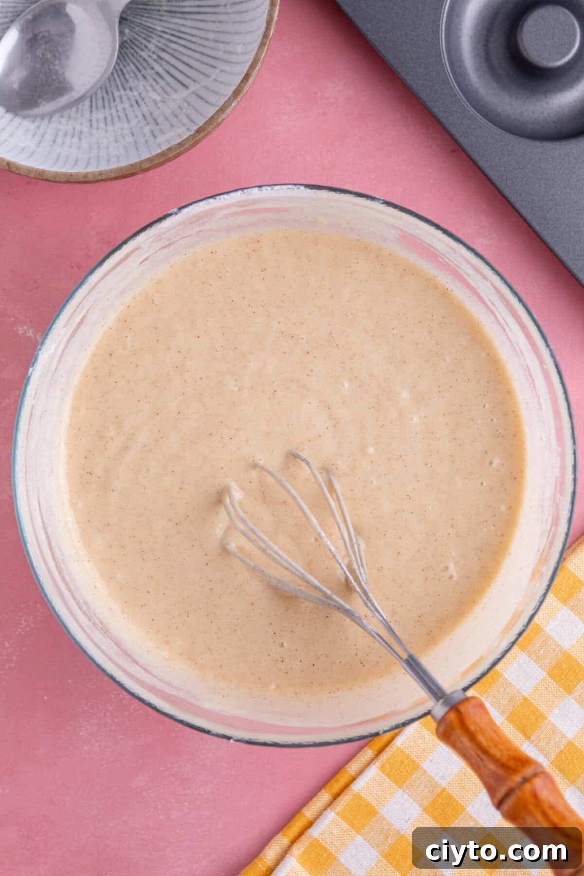 Process shot showing batter in a bowl.