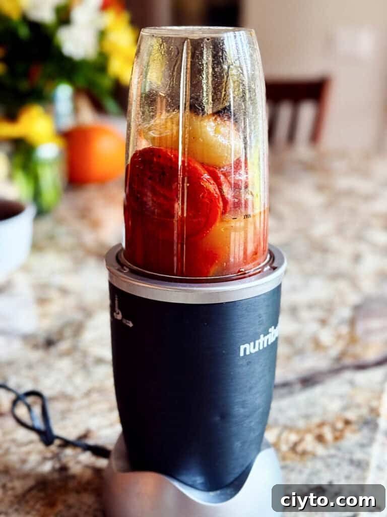 Vegetables in a blender with broth added