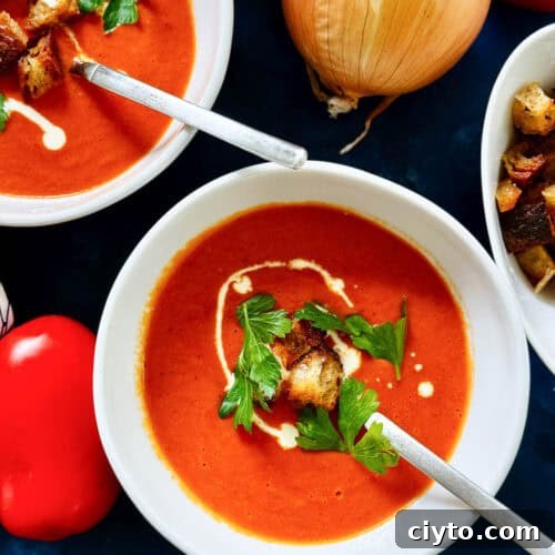 Oven Roasted Tomato Soup in a bowl with spoon