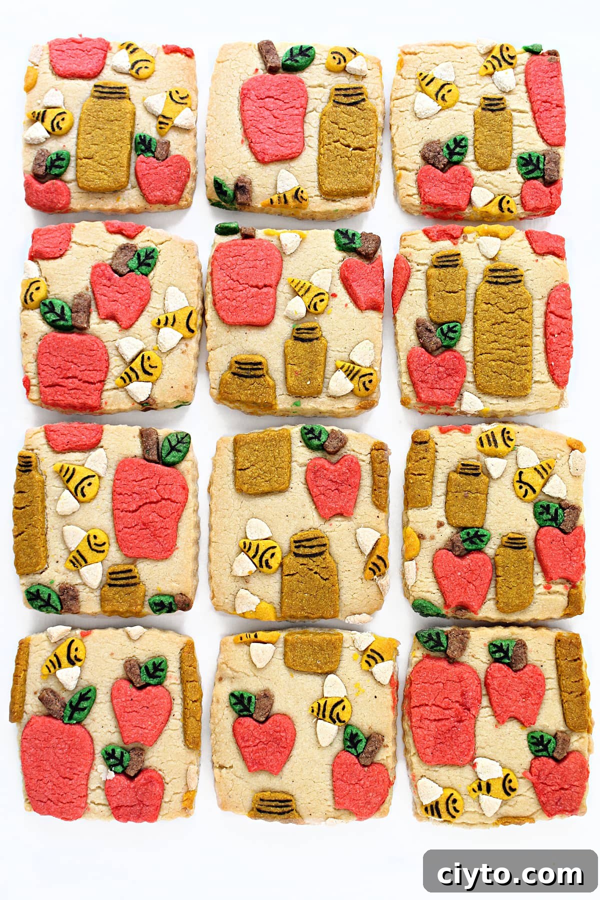 Rosh Hashanah Patterned Cookies: Creative Designs and Ideas 2 Square sugar cookies with colored cookie pieces pressed onto the top in a design.