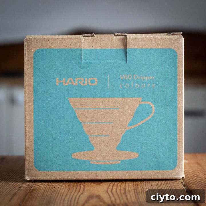 brown and turquoise box for the Hario v60 coffee maker on wooden surface