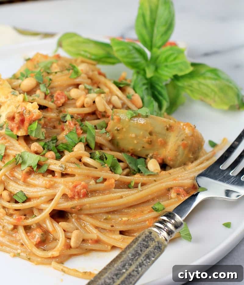 plated pasta on a white plate with a fork