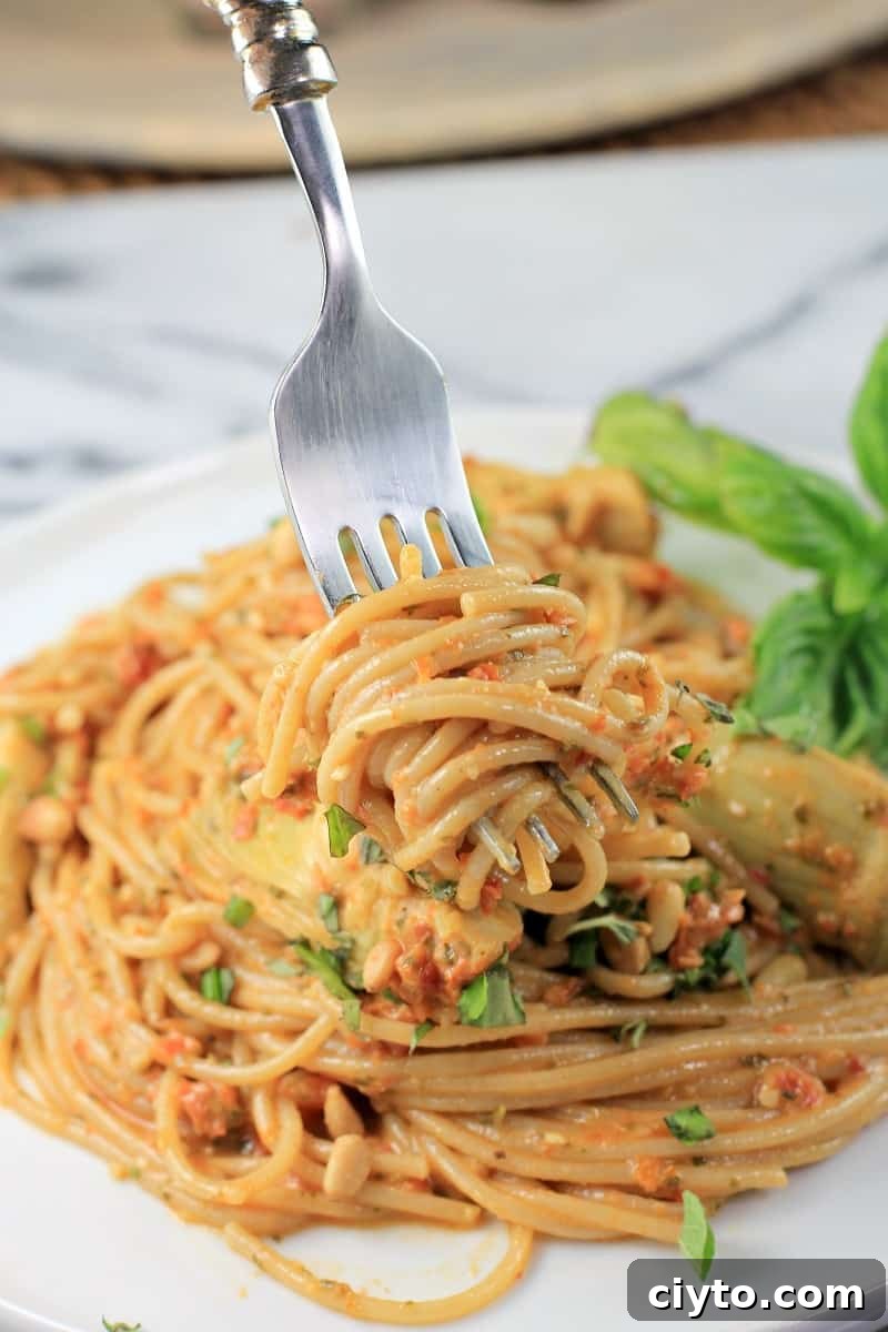 fork twirling up a bite of spaghetti with sauce