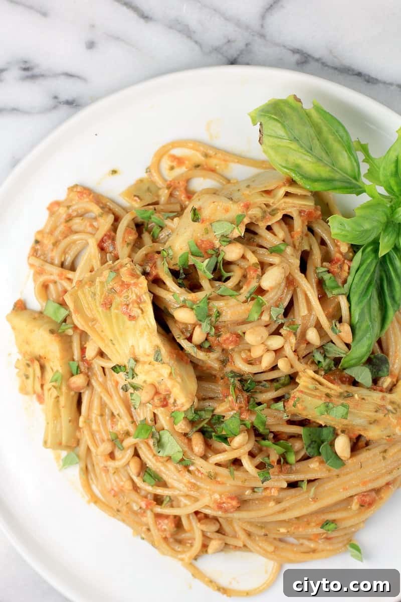 top down view of spaghetti on white plate