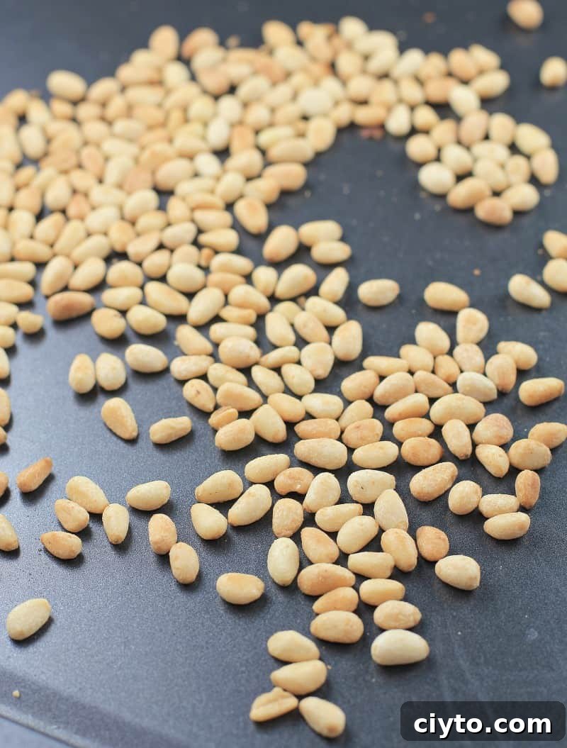 toasted pine nuts on bake sheet
