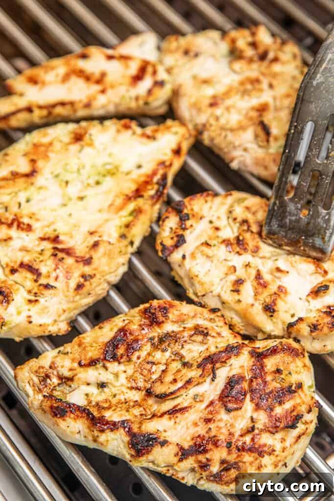 chicken cooking on the grill