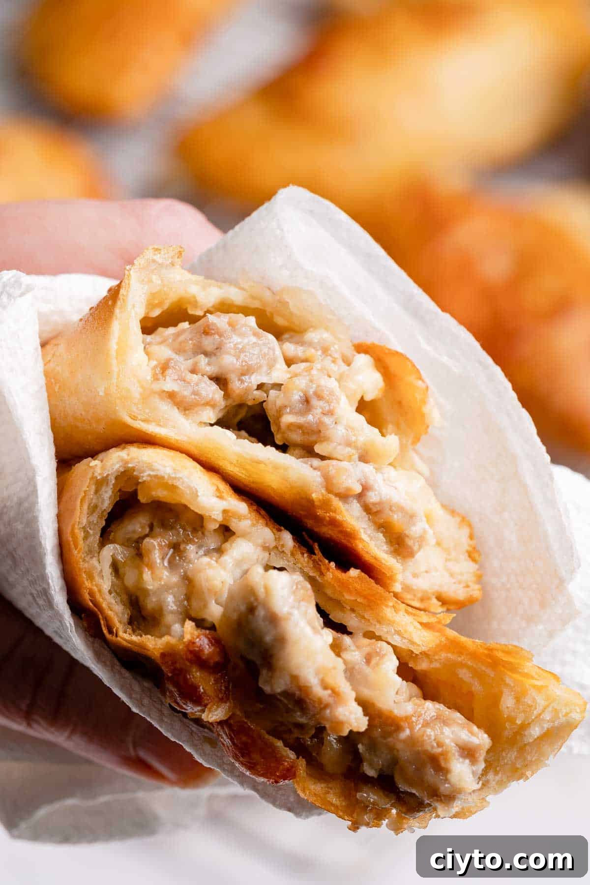 sausage and cheese turnover broken in half