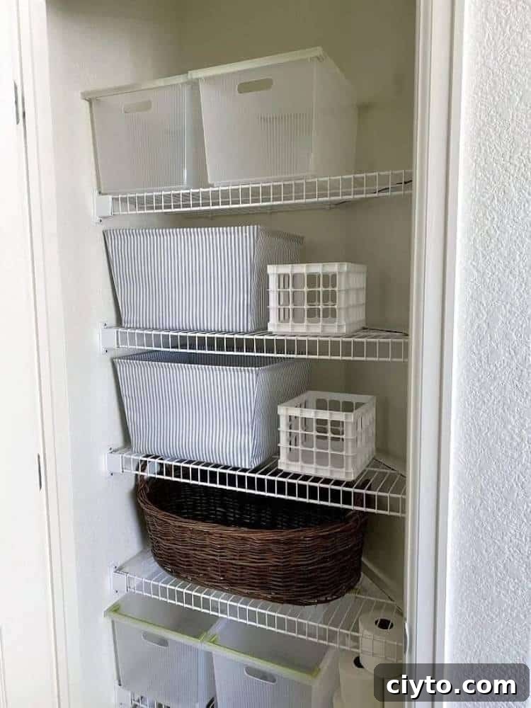 linen closet with baskets, fabric bins and plastic bins on wire shelving