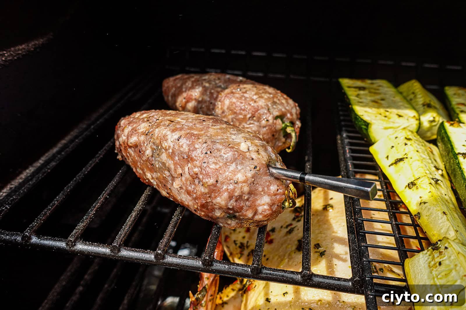 Smoking Texas Torpedoes with ground pork outside on Traeger Pellet Grill