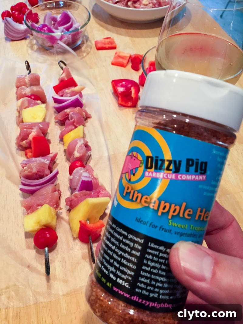 Applying glaze to chicken kabobs
