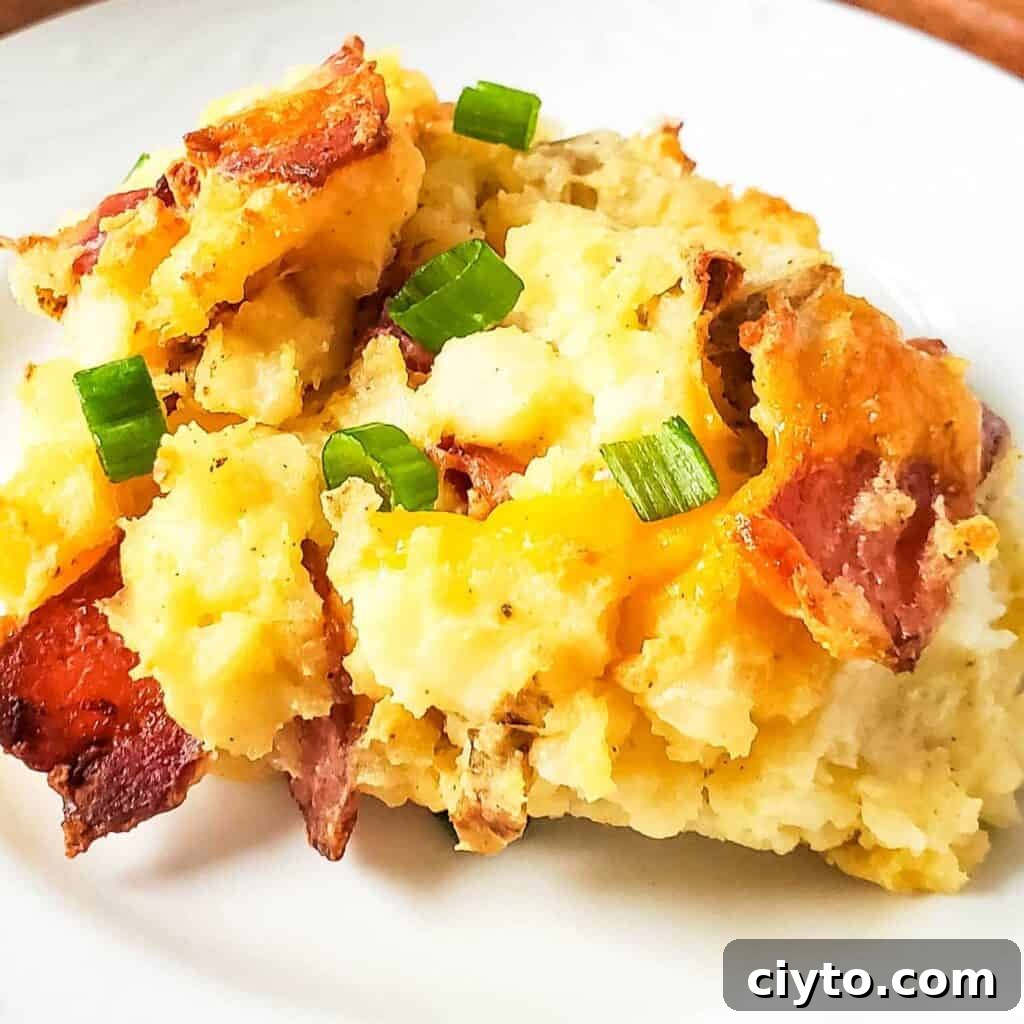 twice baked potato casserole on white plate close up