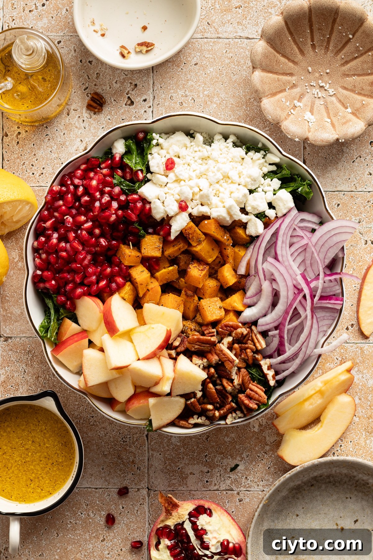 Kale and Butternut Squash Salad with Pomegranate and Apple 7 All ingredients for kale butternut squash salad in a large serving bowl.