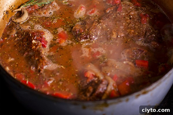 Slow-Braised Tuscan Beef with Garlic Mascarpone Mashed Potatoes 6 Cooking chuck roast in a vegetable and wine flavored broth to make Tuscan Braised Beef.