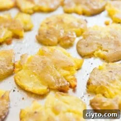 Smashed Potatoes On a Sheet Pan with Crispy Edges and Pepper