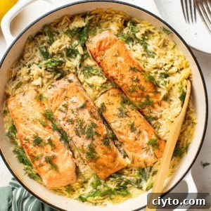 Salmon in a creamy orzo with fresh asparagus and herbs.