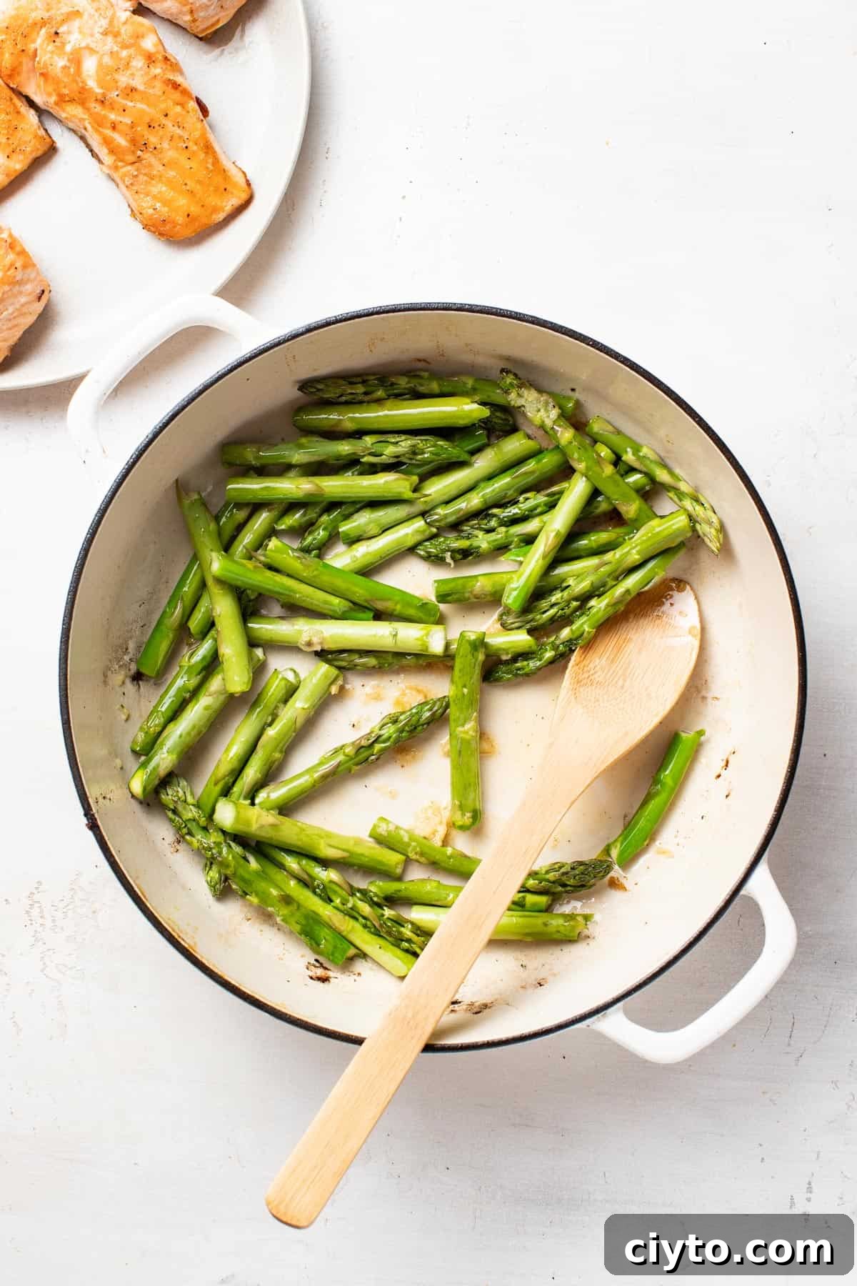 Cooking asparagus in a pan.
