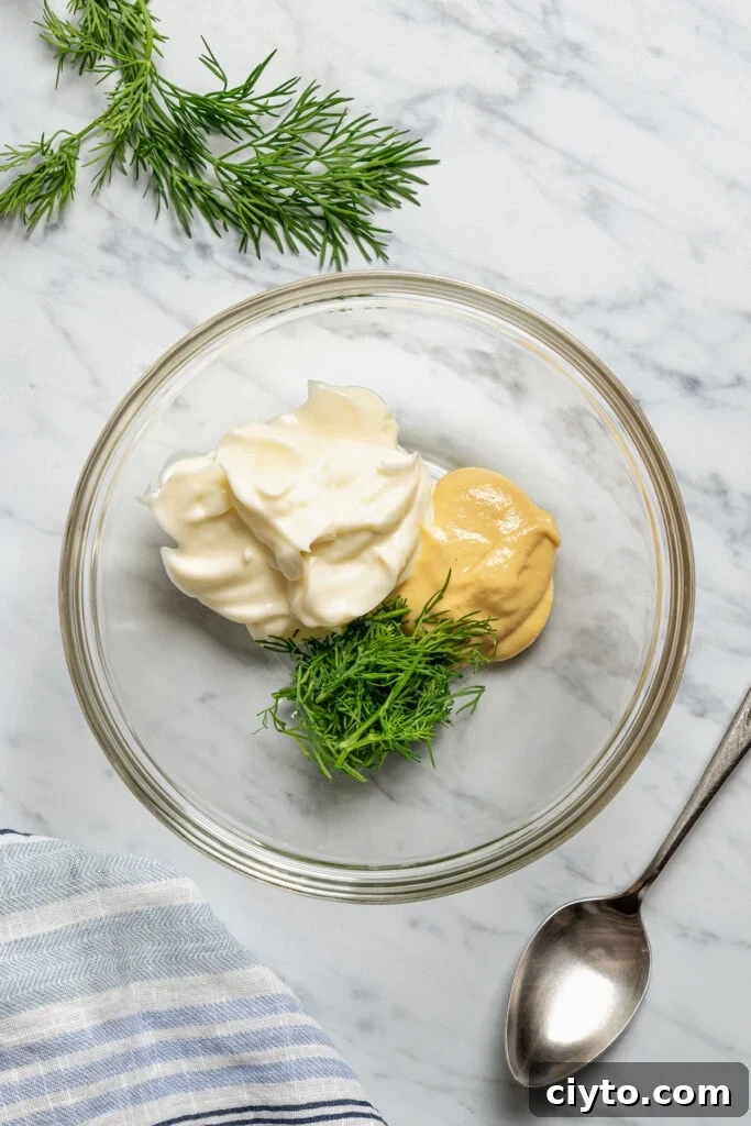 Add the dill, dijon, and mayo to a bowl. Add the dill, dijon, and mayo to a bowl.