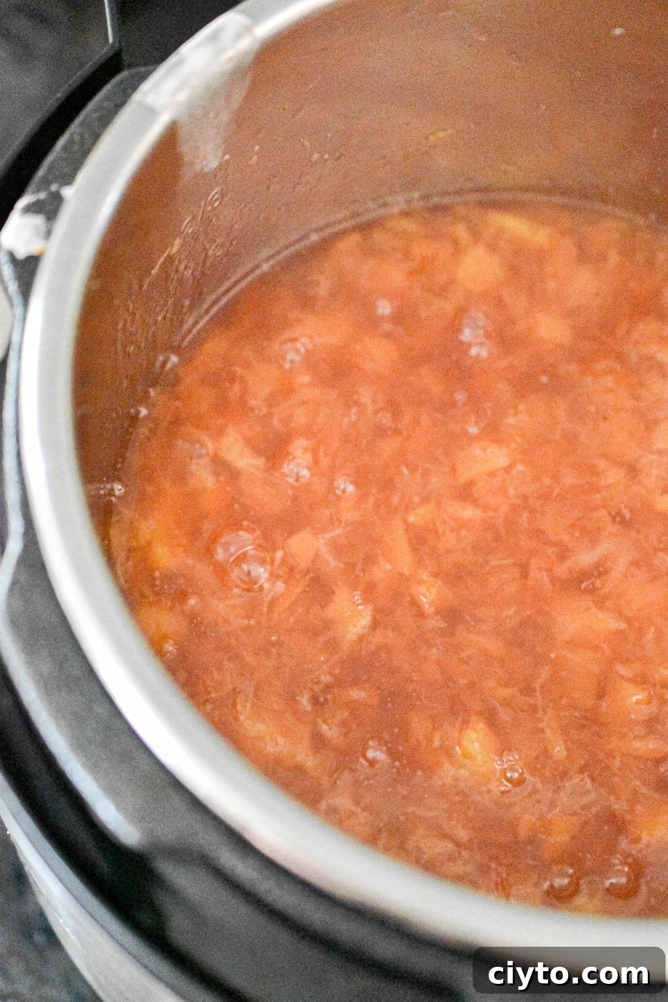 Homemade Instant Pot Peach Jam Recipe 7 A close up of the cooked jam in the Instant Pot