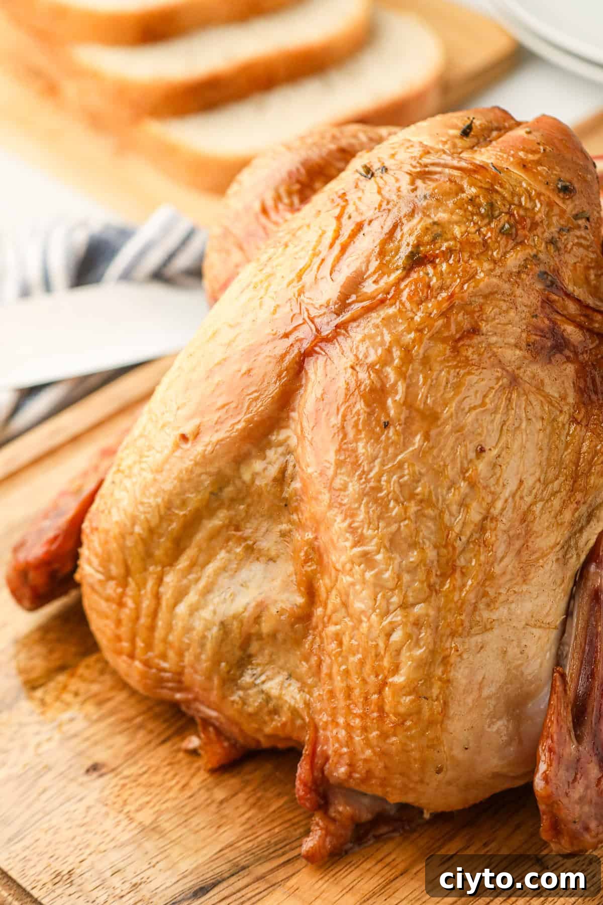 Close up picture of baked turkey on a cutting board