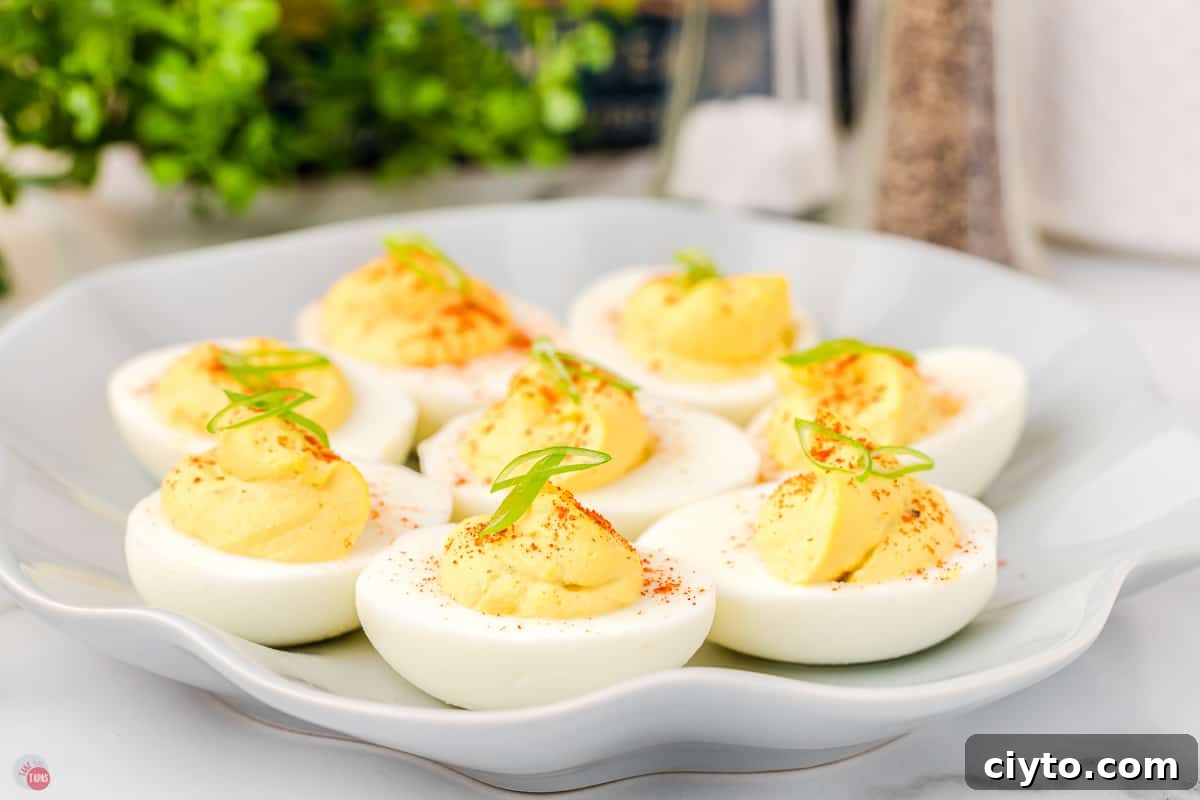 Classic Deviled Eggs Recipe for Parties and Holidays 2 classic deviled eggs on a platter