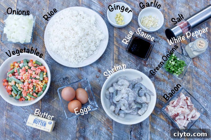 blackstone shrimp fried rice ingredients: shrimp, garlic, ginger, green onions, vegetables, bacon, egg, rice sauce, onions, salt, white pepper, rice
