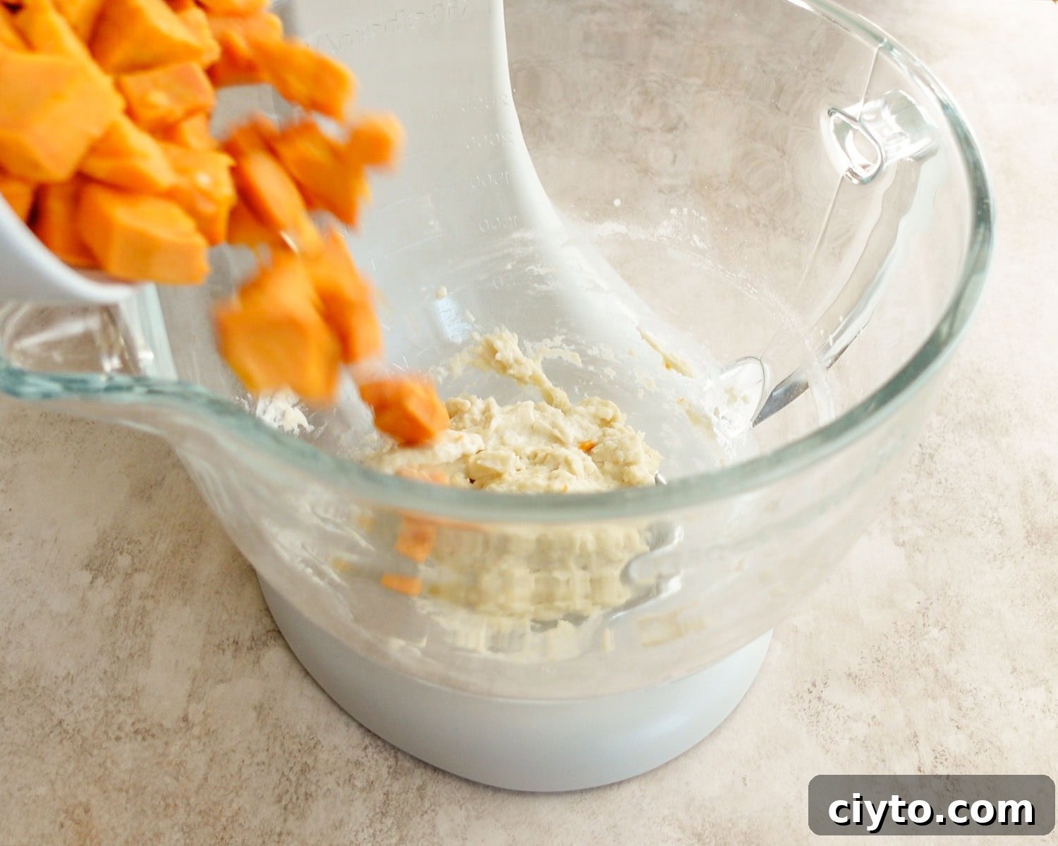 Add cooked sweet potato to flour paste.