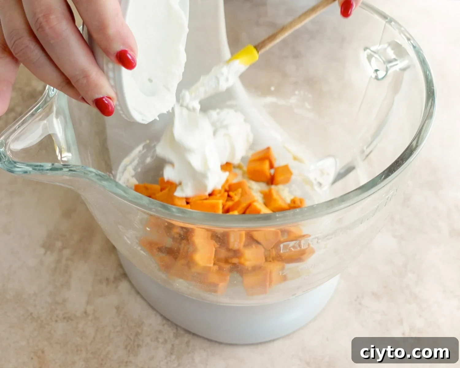 Add sour cream to the bowl.