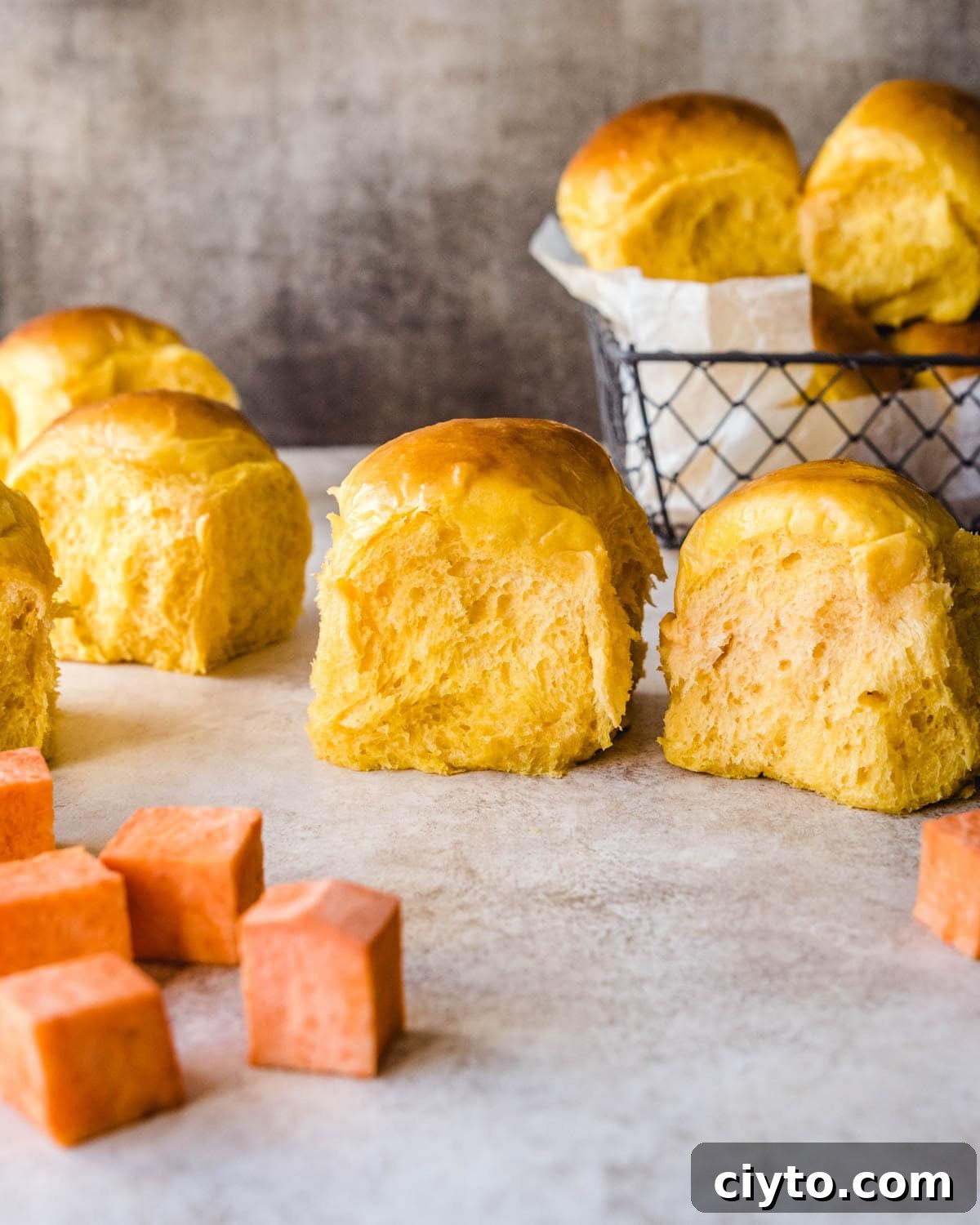 Fluffy sweet potato rolls are perfect for thanksgiving dinner.