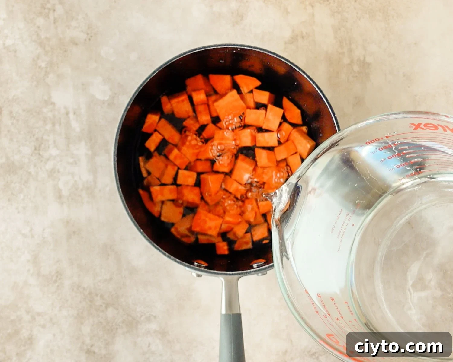 Add 2 cups of water to cover sweet potatoes.