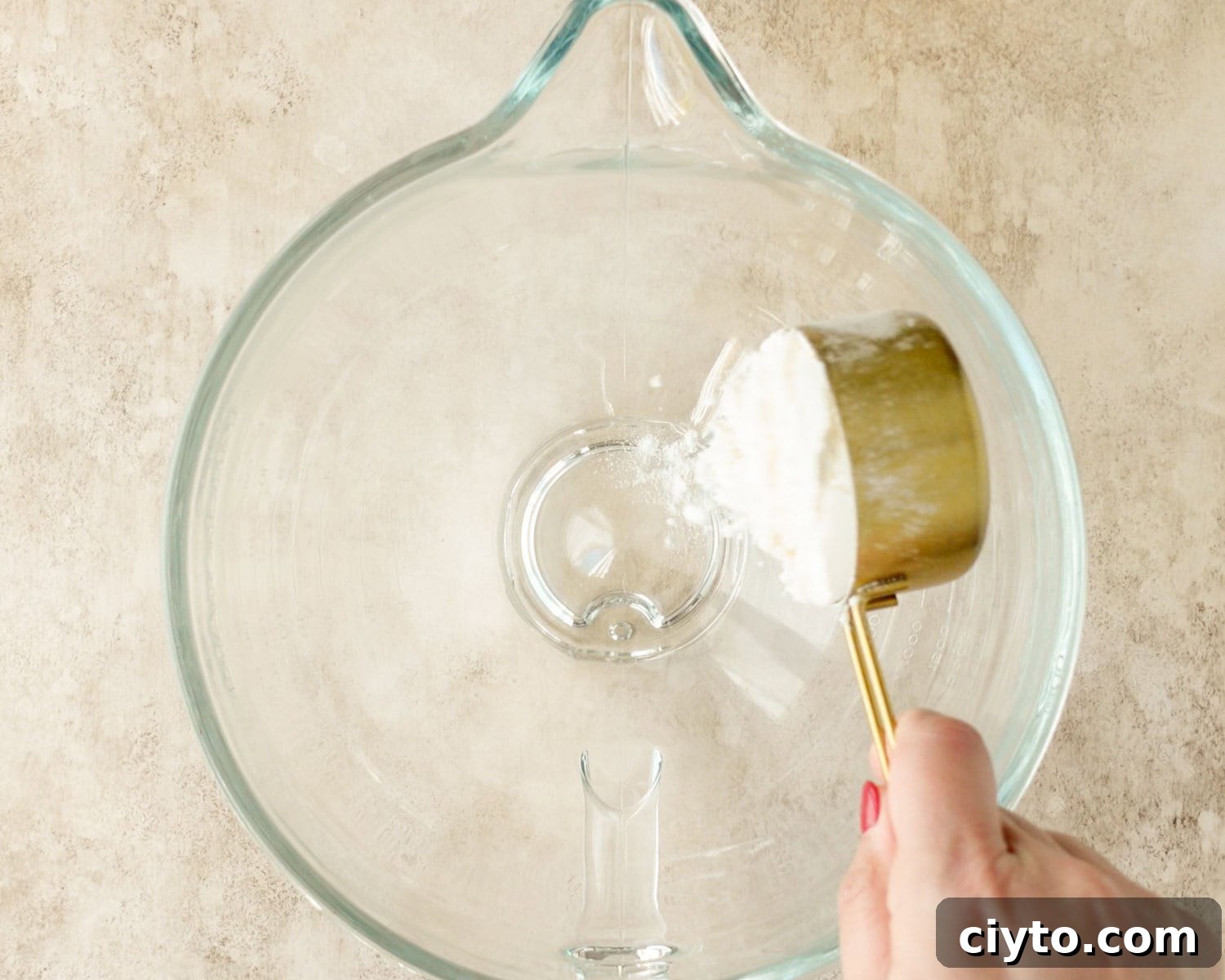 Add flour to the bowl of a stand mixer.