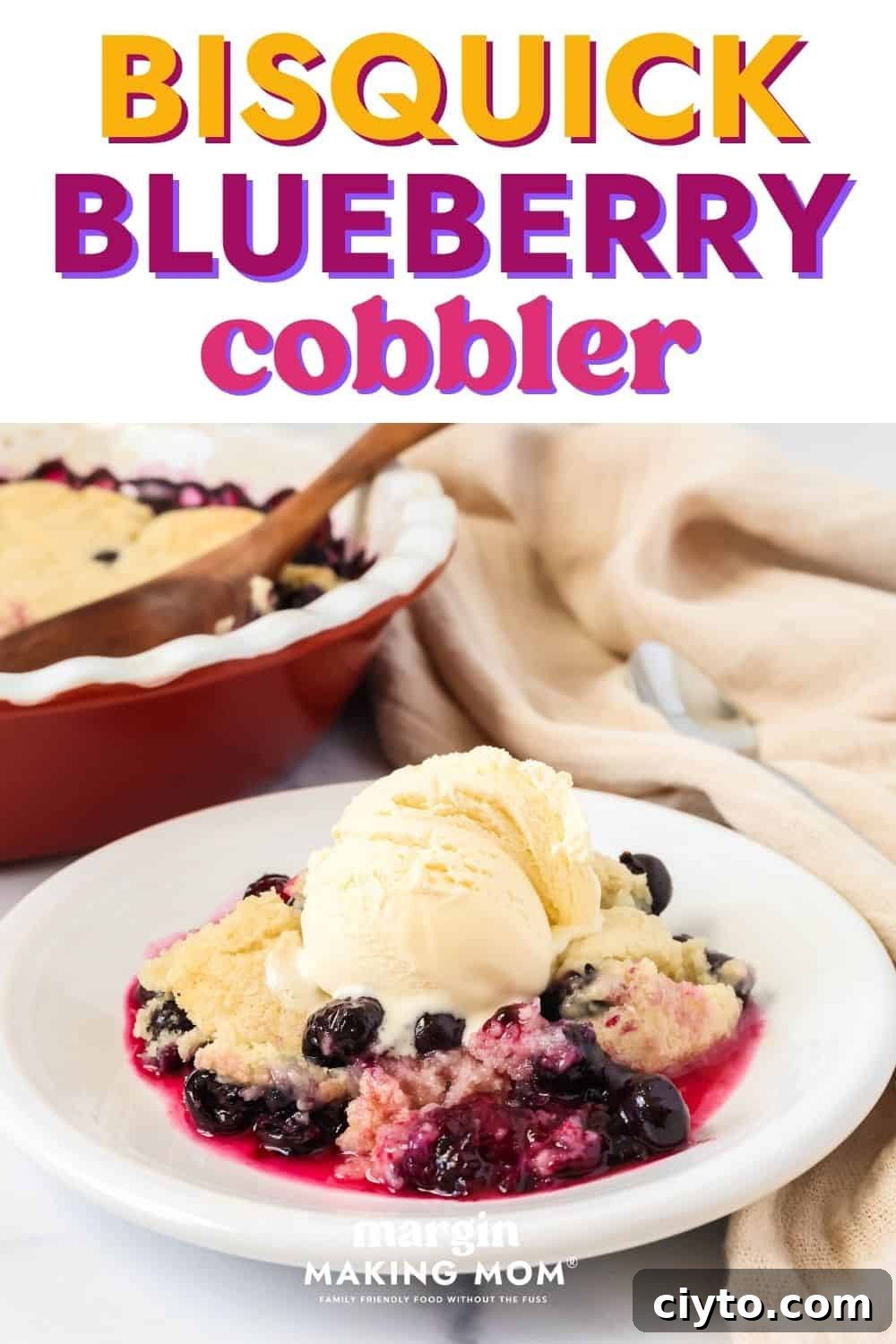 Quick Bisquick Blueberry Cobbler Recipe for Summer 2 Serving of Bisquick blueberry cobbler on a white plate, topped with a scoop of vanilla ice cream. The baking dish of cobbler is in the background.