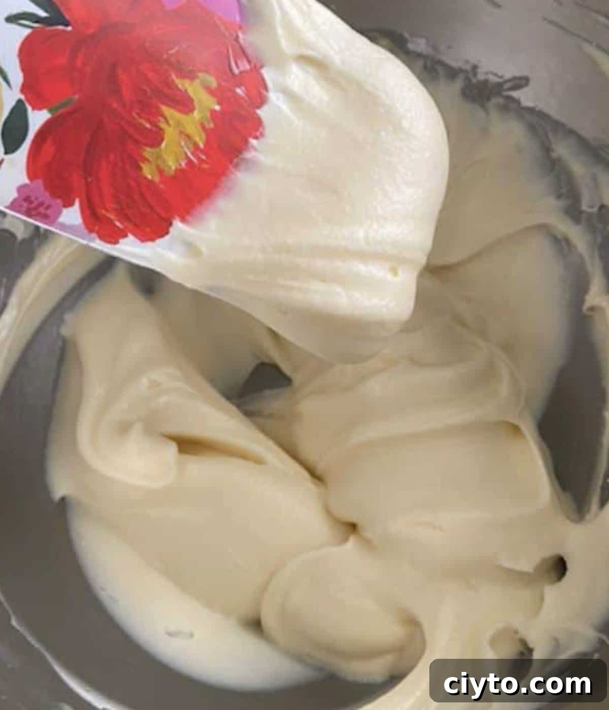 Moist Pumpkin Bread with Cream Cheese Frosting 11 Cream cheese frosting in bowl.