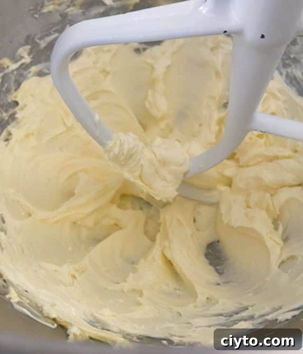 Moist Pumpkin Bread with Cream Cheese Frosting 10 Cream cheese beating in stand mixer.