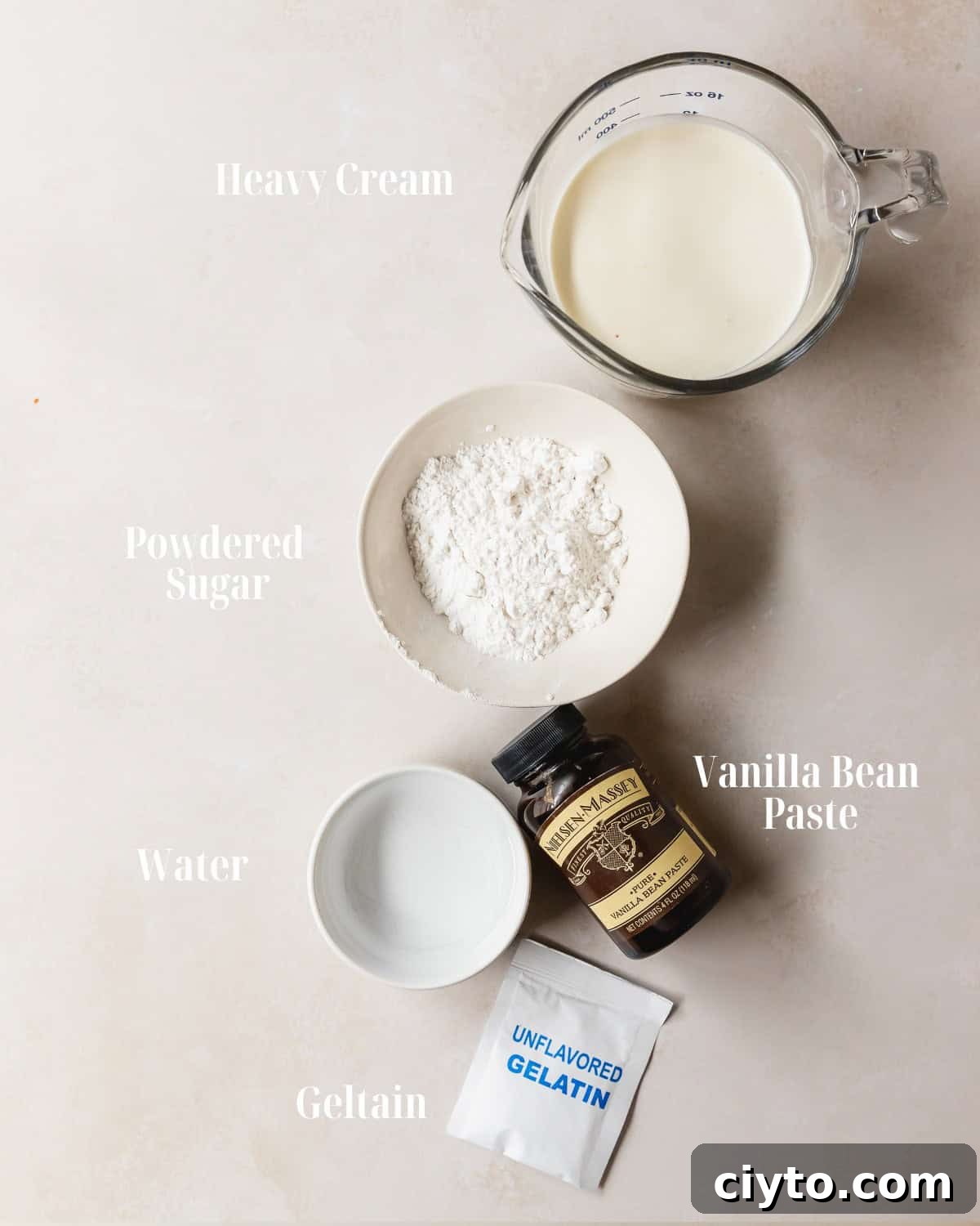 Ingredients:  Gather unflavored gelatin, water, heavy cream, powdered sugar and vanilla bean paste.