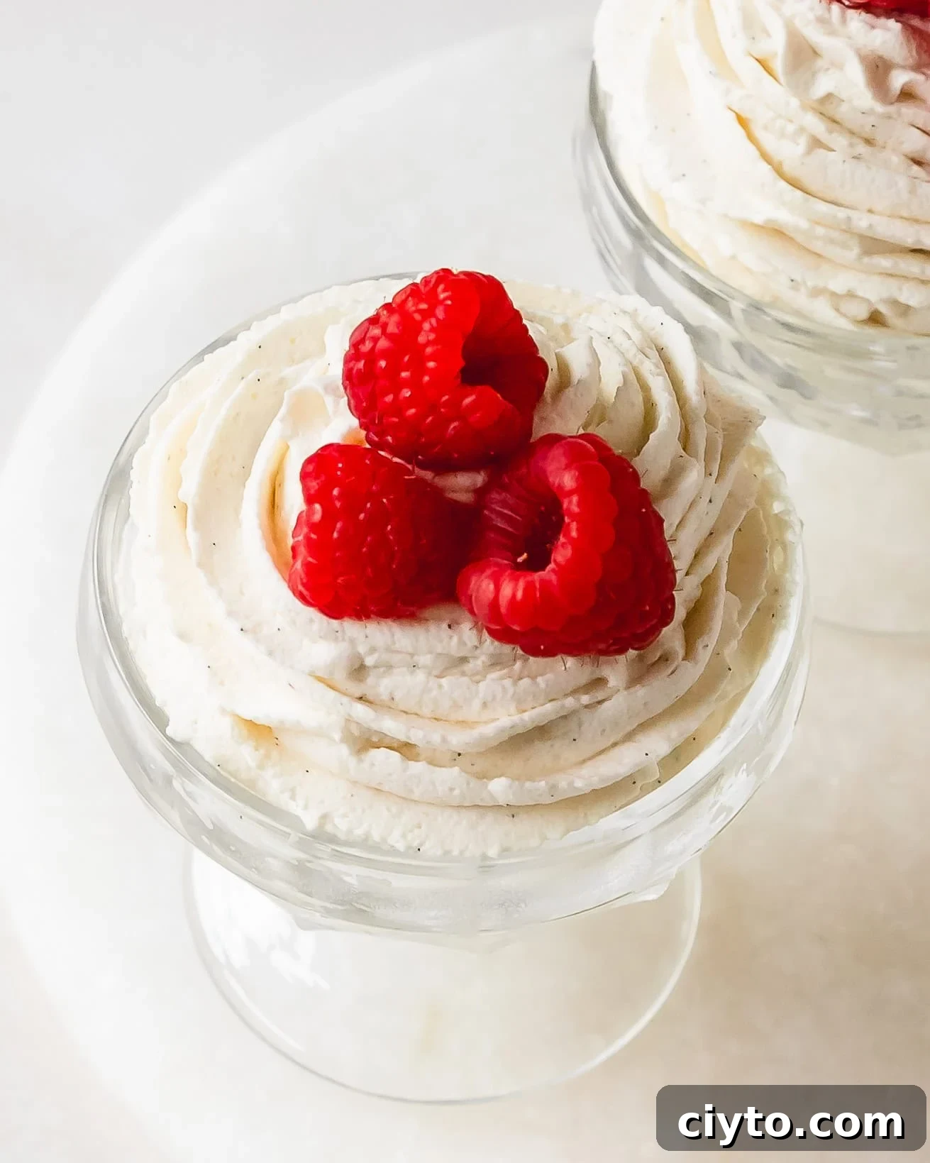 Vanilla mousse is a light, fluffy and creamy mousse filled with flecks of sweet vanilla bean. This vanilla bean mousse is perfect easy to make with a few ingredients. Serve this mousse alongside cake or with fruit for the perfect simple dessert.