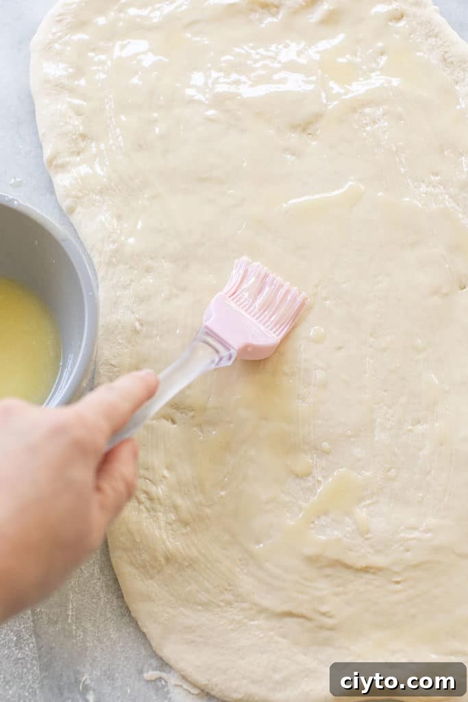 Spread butter over the rolled out dough.