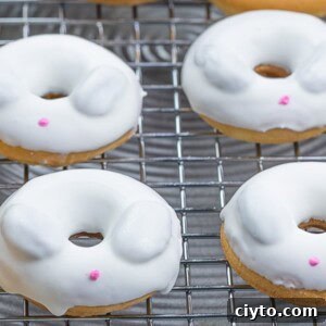 mini Easter bunny donuts with candy melt on a cooling rack