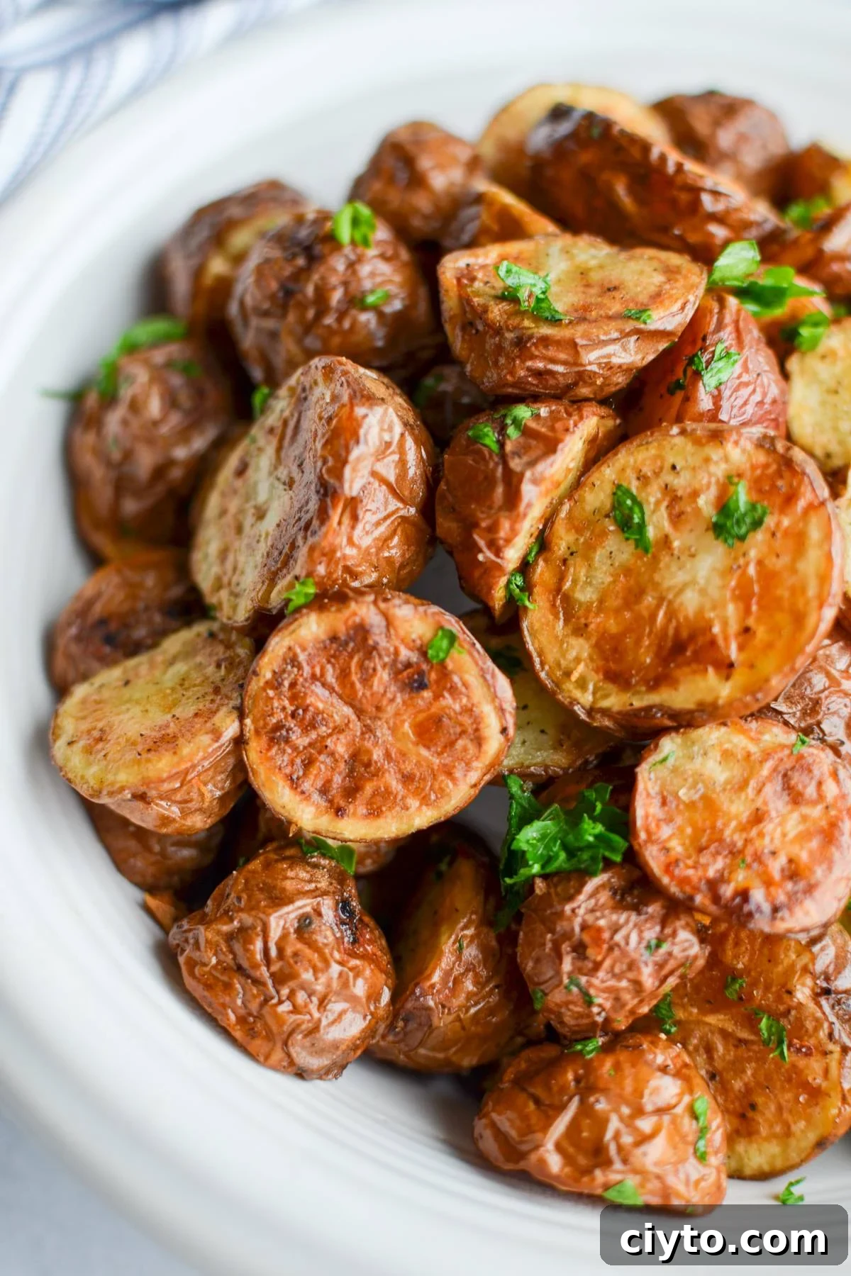 A bowl of roasted baby potatoes.