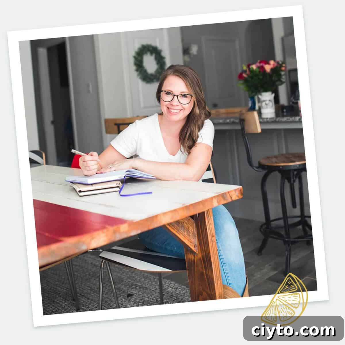 Warm Apple Cookies with Butterscotch Frosting 3 Author sitting at table smiling