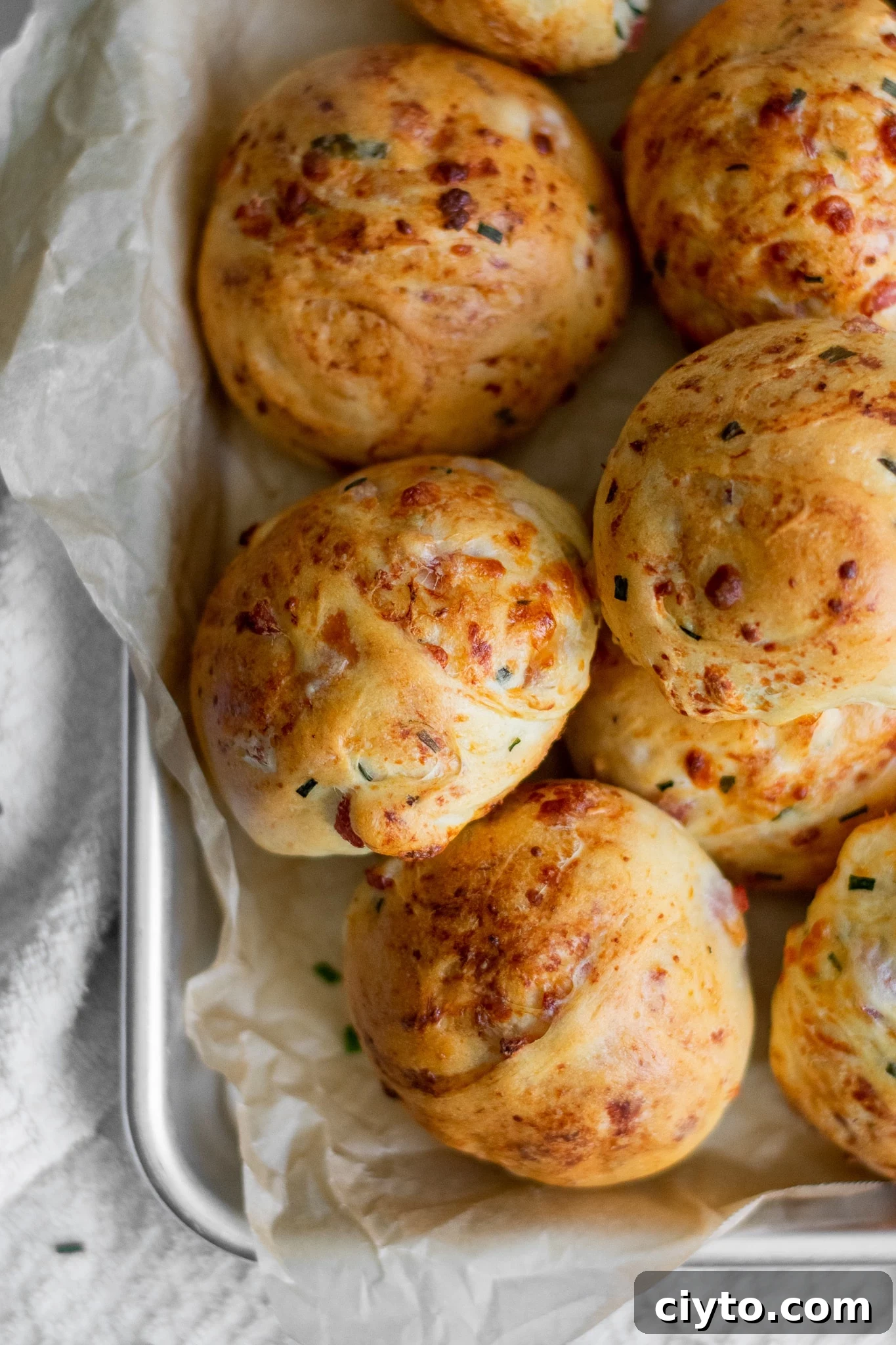 Hyggeboller: Danish Ham and Cheese Rolls 3 Rolls with ham, cheese, and chives.