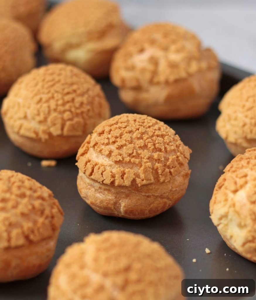 Baked Choux au Craquelin coming out of the oven