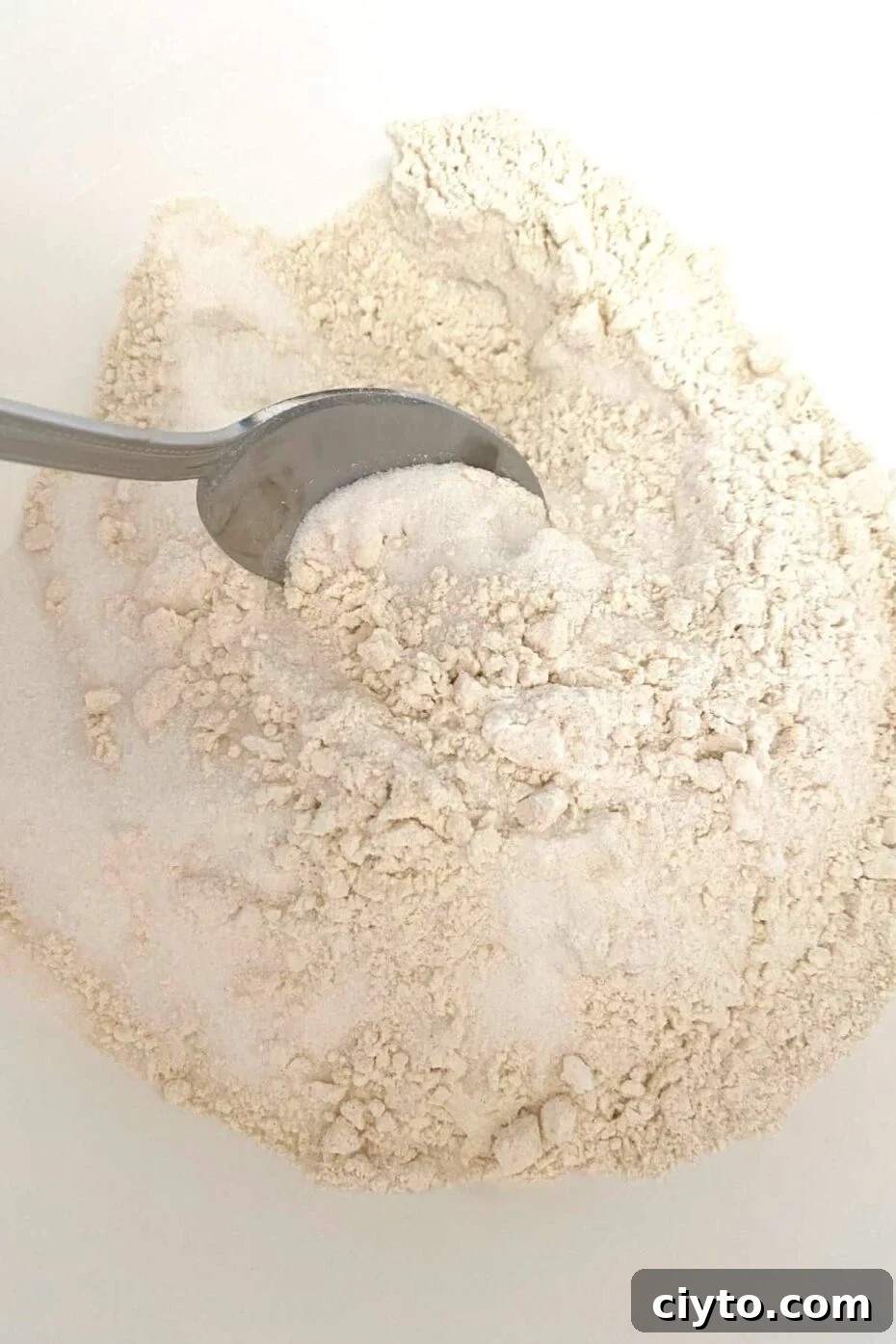 Preparing dry ingredients for homemade yellow cake mix