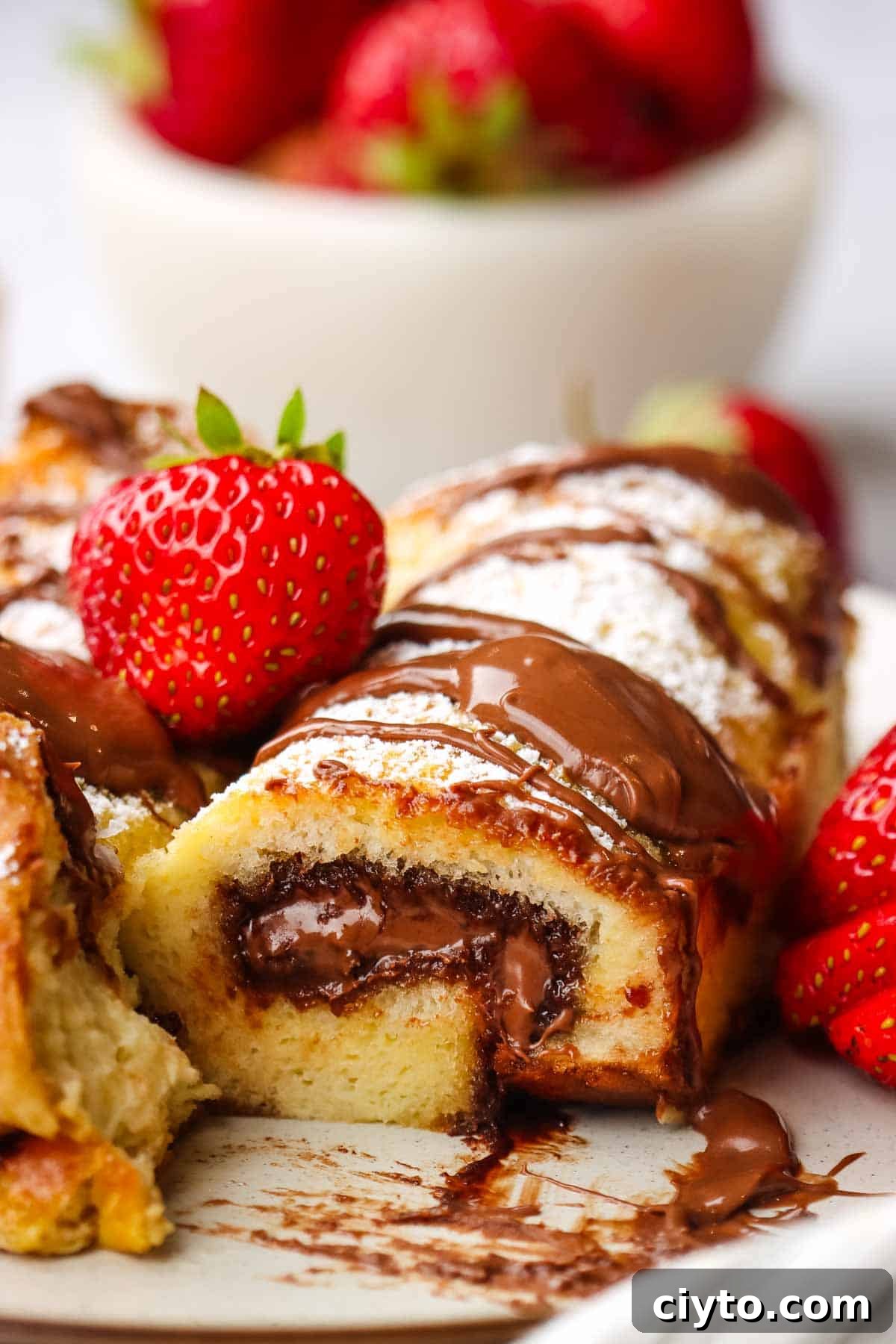 inside of a nutella french toast roll with gooey nutella