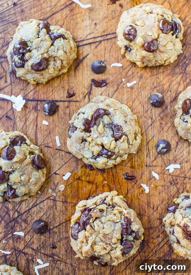 Chewy oatmeal coconut chocolate chip cookies stacked together