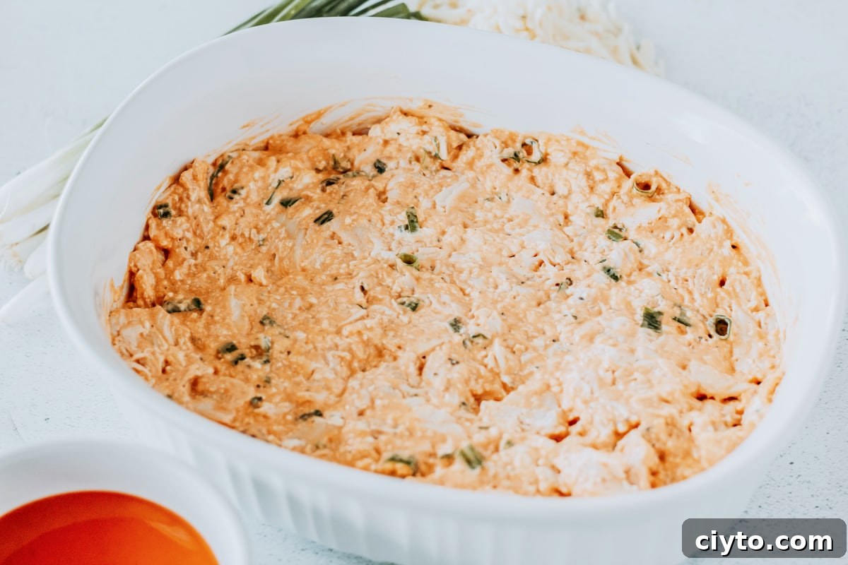 spread chicken mixture in casserole dish