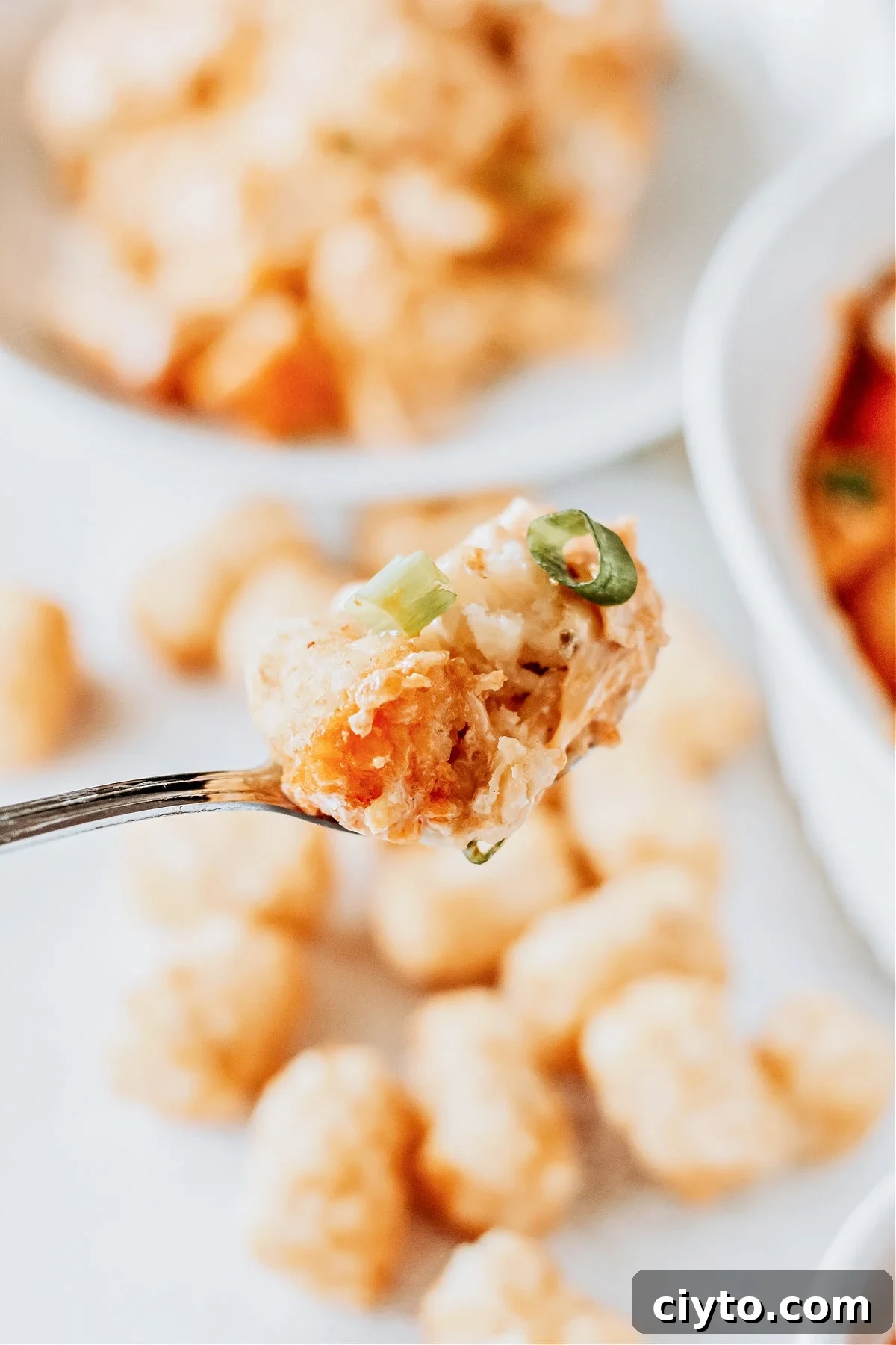 Buffalo Chicken Tater Tots bite on fork