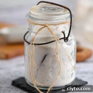 An old glass jar filled with Homemade Vanilla Sugar