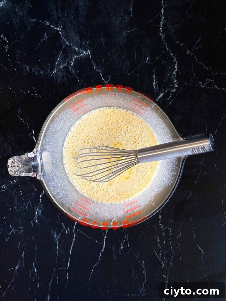 Seasoned egg mixture in a mixing bowl.